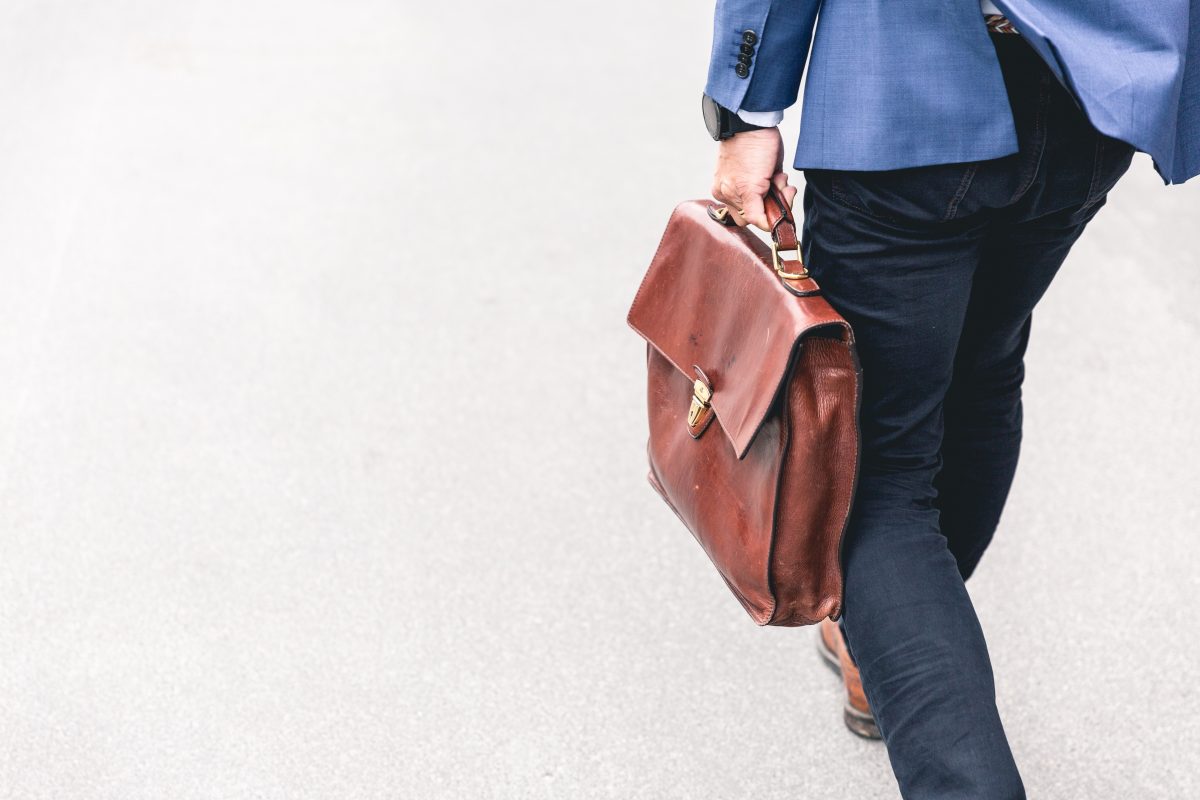 Man walking with leather bag